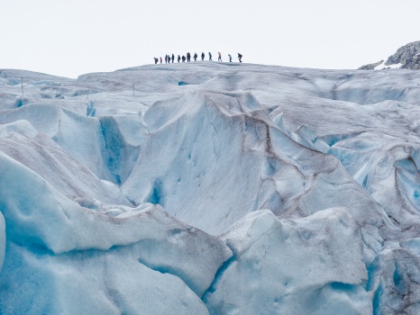 People haiking on a glacier in Norway