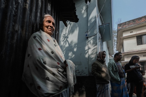 An old woman in light and shadow