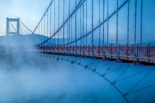 Steel-frame bridge in the fog