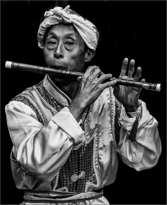 playing with his flute