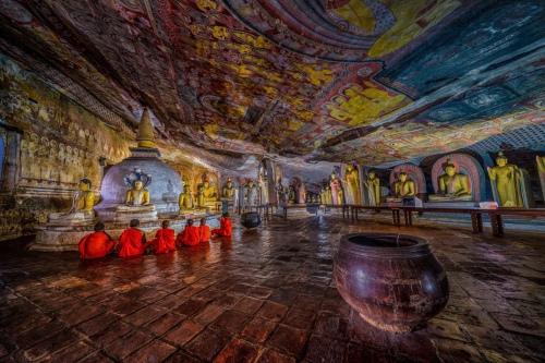 Praying Inside Cave Temple